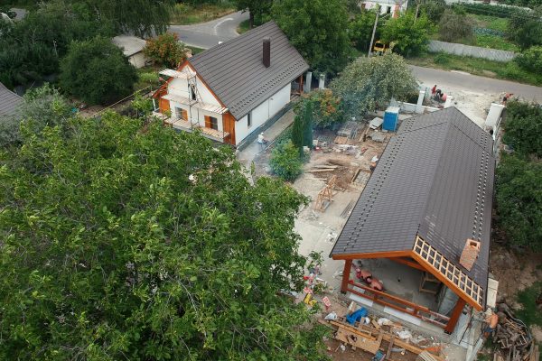 New private housing development construction in rural countryside aerial view. Drone photo.